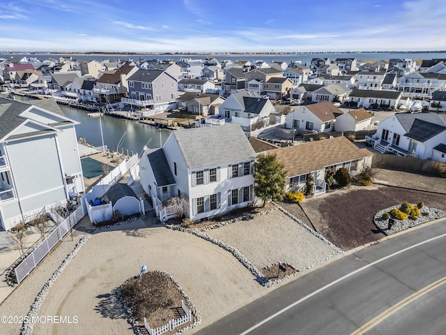 aerial view featuring a water view and a residential view