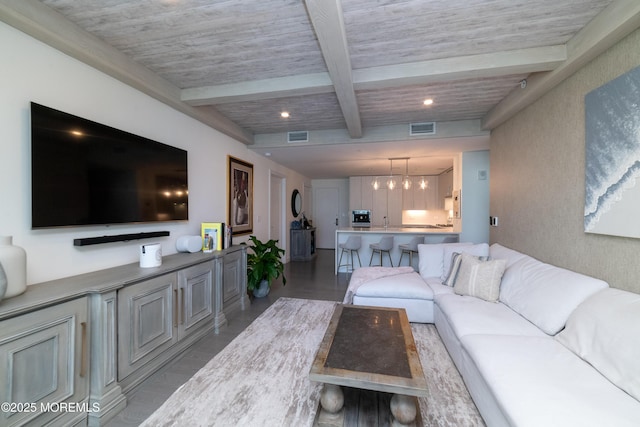 living room with beamed ceiling, wood finished floors, visible vents, and recessed lighting