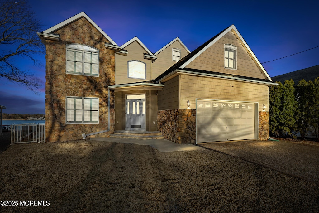 53 Edwards Rd, Brick, NJ 08723 - traditional home with aphalt driveway, a garage, and stone siding