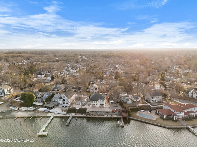 drone / aerial view featuring a water view and a residential view