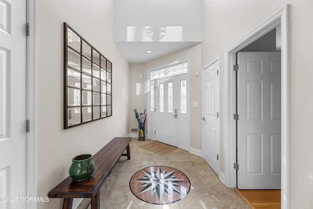 foyer entrance with visible vents