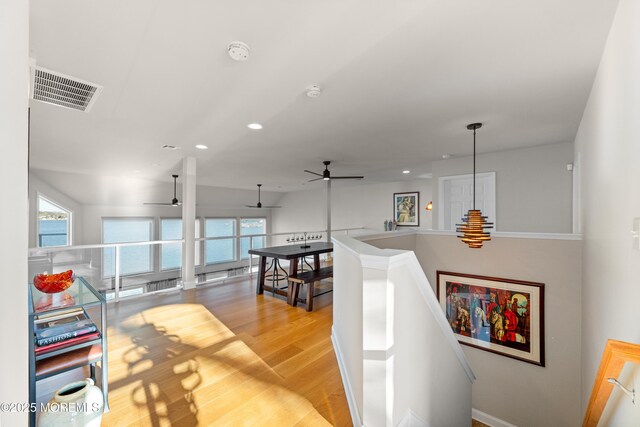 interior space featuring plenty of natural light, light wood-style flooring, visible vents, and recessed lighting