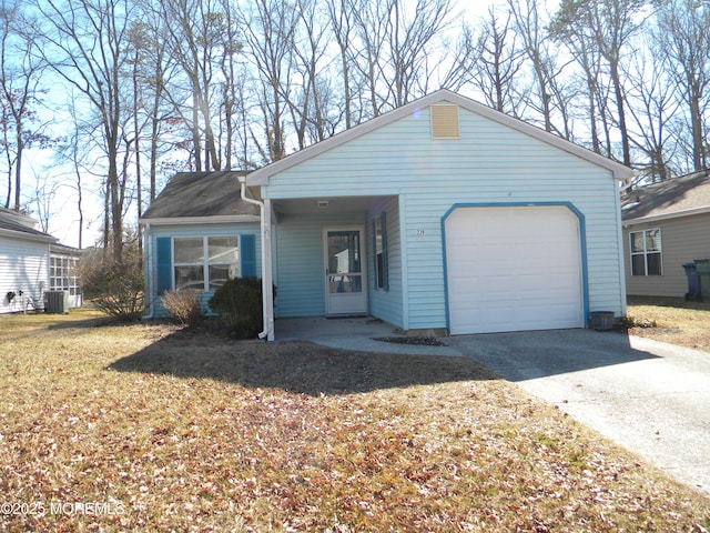 single story home featuring cooling unit, driveway, an attached garage, and a front yard