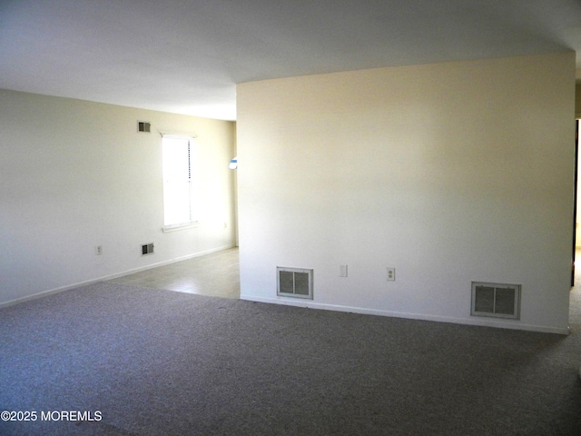 carpeted spare room with visible vents