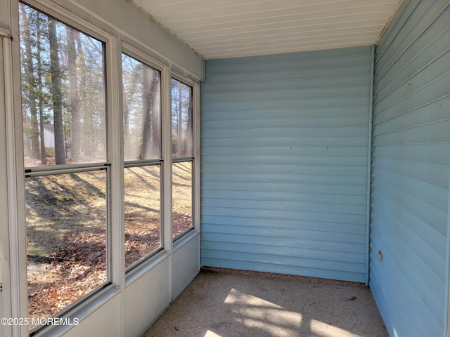 unfurnished sunroom featuring plenty of natural light