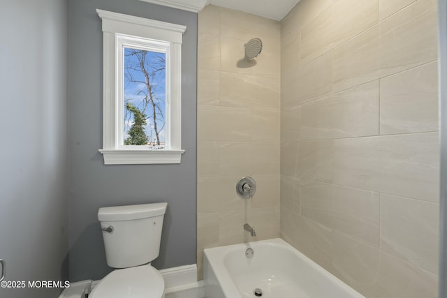 bathroom featuring toilet and bathtub / shower combination