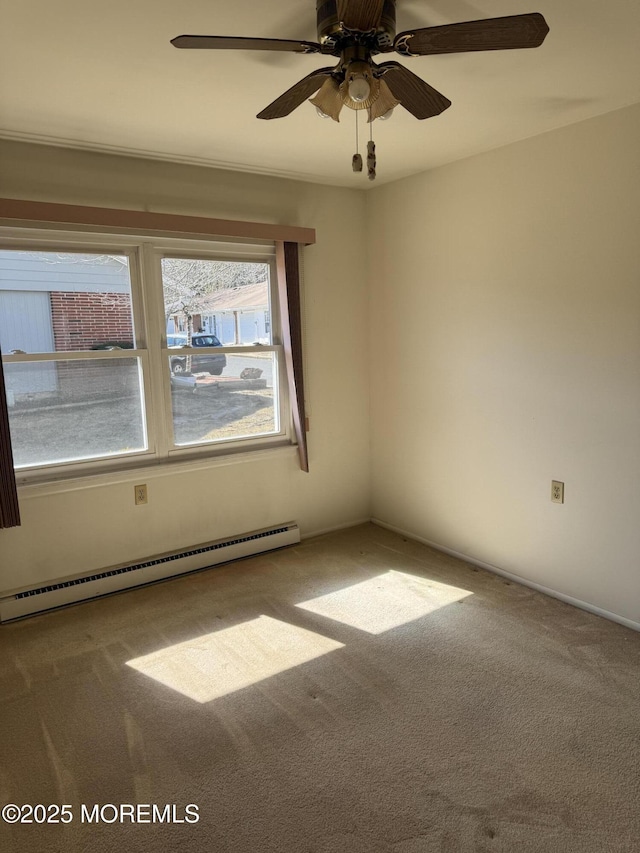 unfurnished room featuring a baseboard heating unit, ceiling fan, and carpet flooring