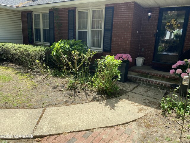 550 Wall St, Eatontown, NJ 07724 - doorway to property with brick siding