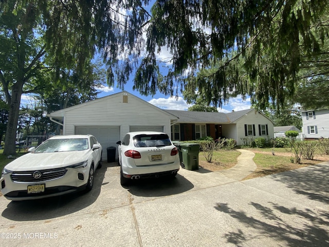 550 Wall St, Eatontown, NJ 07724 - ranch-style house featuring a garage and concrete driveway