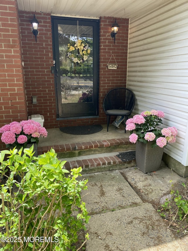 550 Wall St, Eatontown, NJ 07724 - entrance to property with brick siding and covered porch