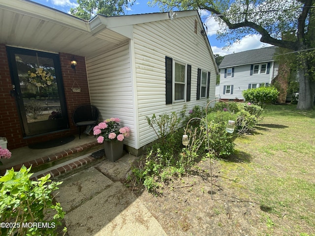 550 Wall St, Eatontown, NJ 07724 - entrance to property featuring a yard and brick siding