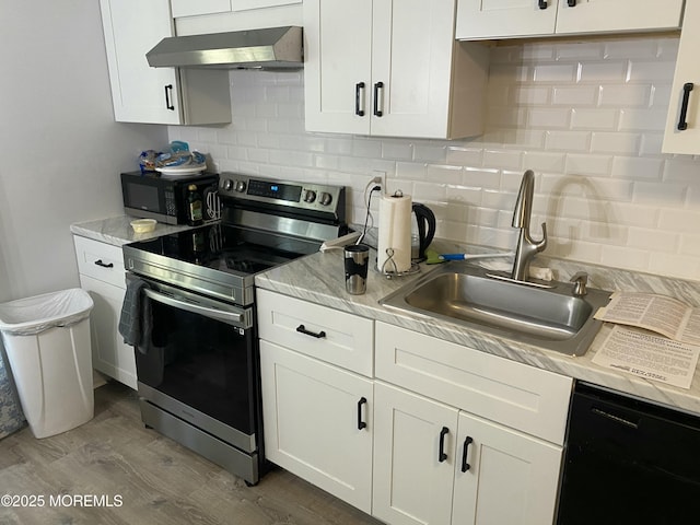 550 Wall St, Eatontown, NJ 07724 - kitchen featuring black appliances, range hood, a sink, backsplash, and white cabinets