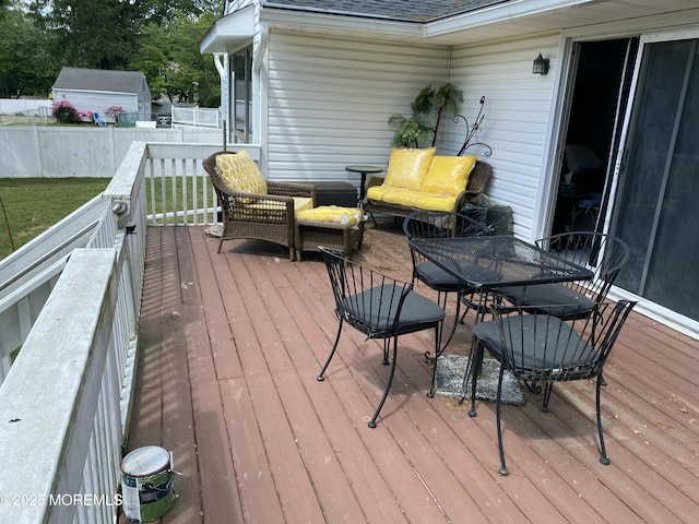 550 Wall St, Eatontown, NJ 07724 - wooden deck featuring an outdoor living space and outdoor dining area
