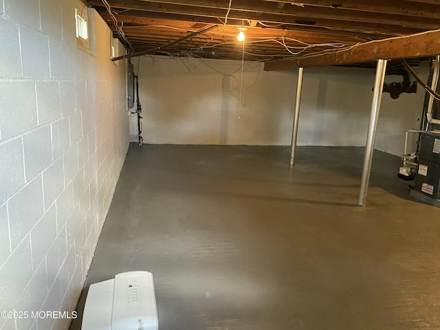 550 Wall St, Eatontown, NJ 07724 - unfinished below grade area with concrete block wall and radiator