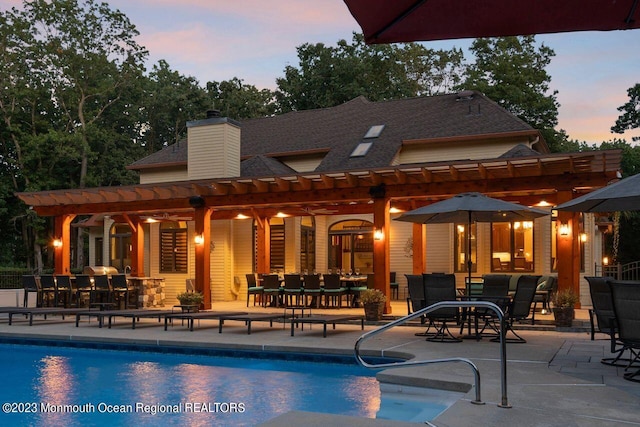 4024 Quarry Rd, Manchester, NJ 08759 - back of property with a pergola, a patio area, and an outdoor pool