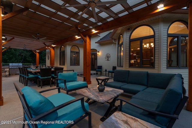 view of patio featuring outdoor lounge area, a ceiling fan, outdoor dining space, a grill, and exterior kitchen