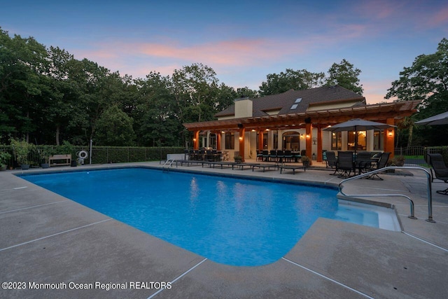 view of pool featuring a patio area, fence, and a fenced in pool