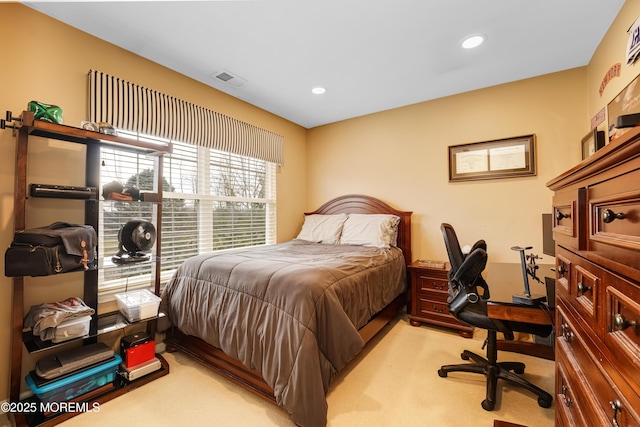 bedroom featuring recessed lighting, light colored carpet, and visible vents