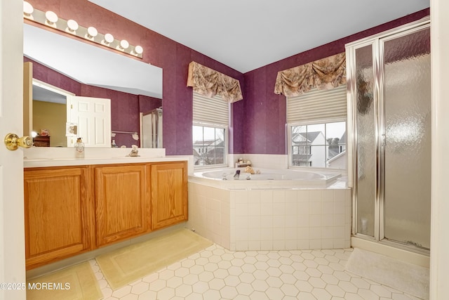 bathroom with tile patterned flooring, a shower stall, vanity, and a bath