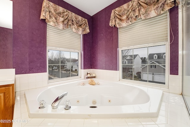 full bathroom featuring a tub with jets