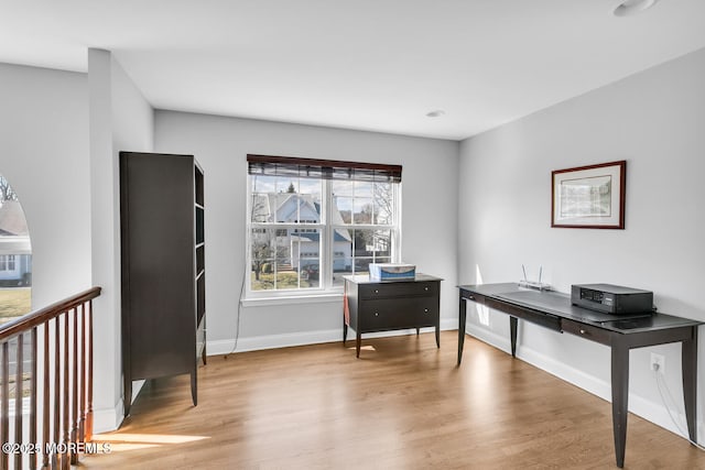 home office featuring light wood-style floors and baseboards