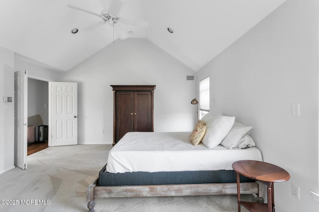 bedroom with lofted ceiling, ceiling fan, visible vents, and light colored carpet