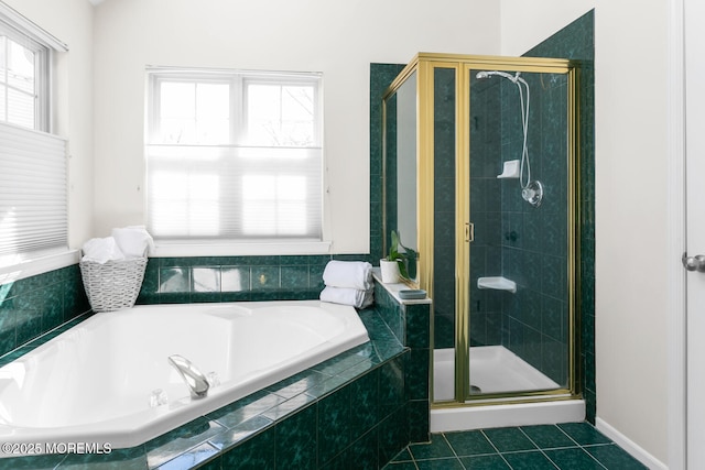 full bathroom featuring a stall shower, tile patterned flooring, and a bath