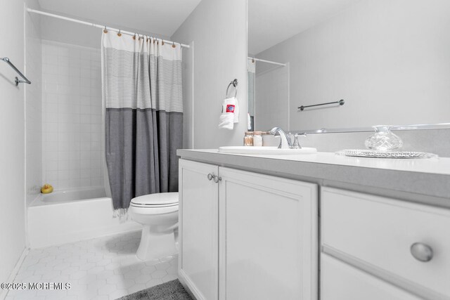 full bath featuring shower / bath combo, vanity, toilet, and tile patterned floors