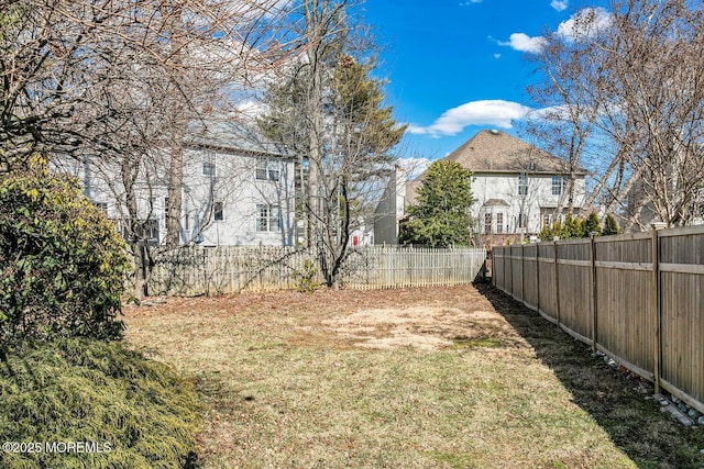 view of yard with a fenced backyard