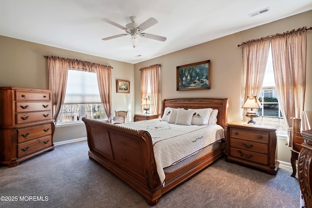 bedroom with carpet floors, baseboards, visible vents, and a ceiling fan