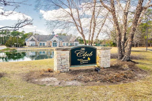 community sign with a water view