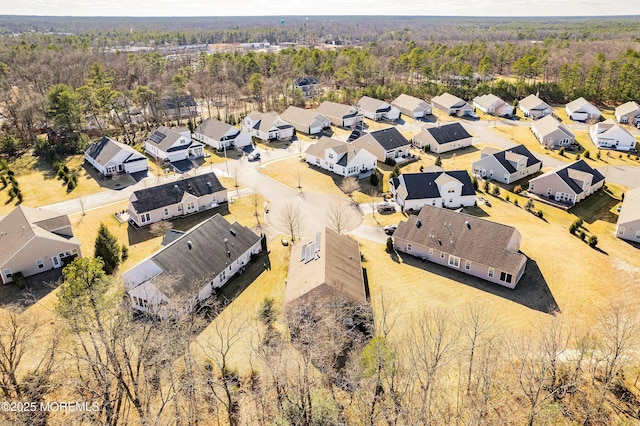 birds eye view of property with a residential view and a view of trees