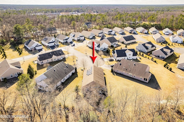 bird's eye view featuring a residential view and a view of trees