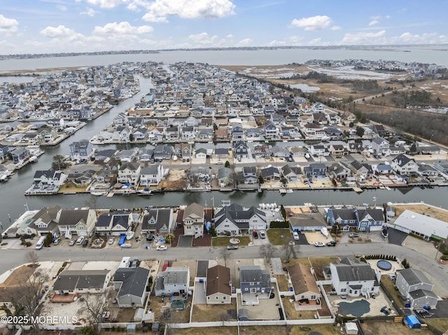 bird's eye view featuring a residential view and a water view