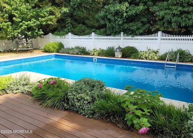 view of swimming pool featuring a fenced in pool and fence