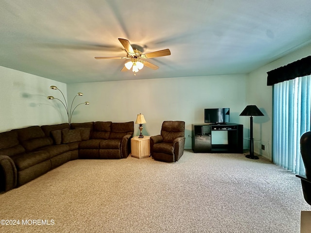 carpeted living room with a ceiling fan