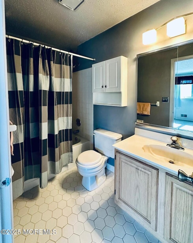 full bath featuring a textured ceiling, tile patterned flooring, toilet, vanity, and shower / bath combination with curtain