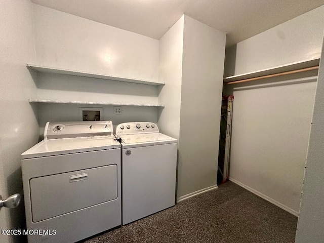 laundry room with laundry area, washer and clothes dryer, and baseboards