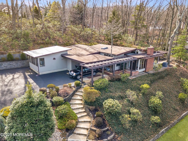 drone / aerial view with a view of trees