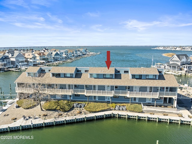 bird's eye view with a water view and a residential view