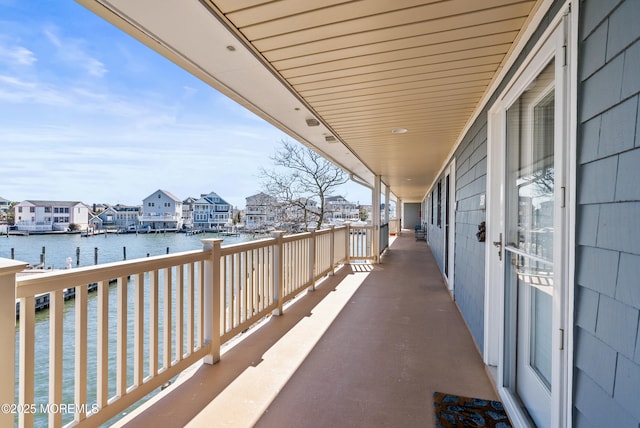 balcony featuring a water view