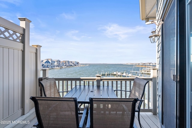 balcony featuring a water view