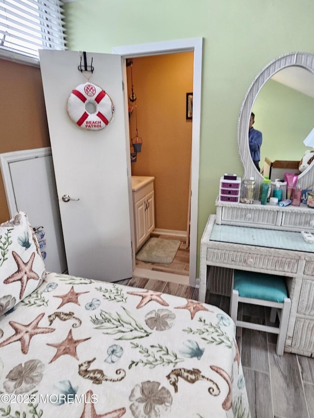 bedroom with wood finish floors