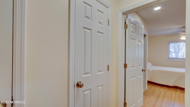 hallway with light wood-type flooring