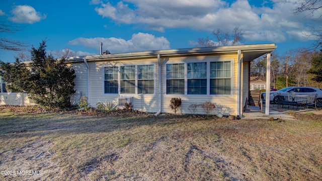 view of side of property with a yard