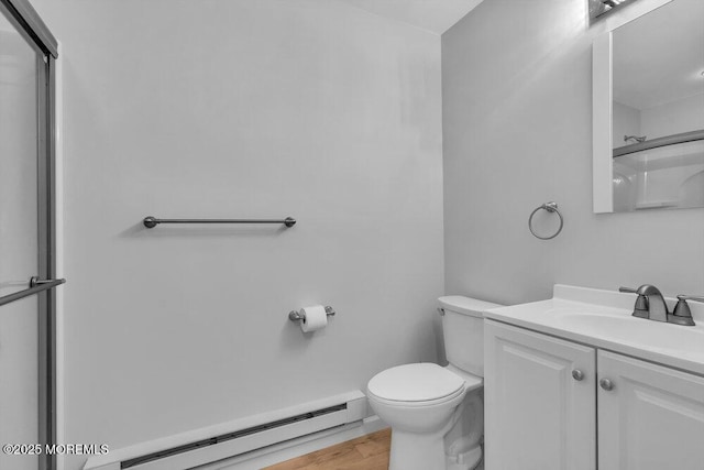 full bathroom with toilet, an enclosed shower, a baseboard heating unit, vanity, and wood finished floors