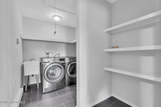 laundry area with laundry area, washer and clothes dryer, attic access, and baseboards