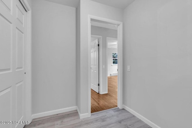 interior space with light wood-type flooring and baseboards