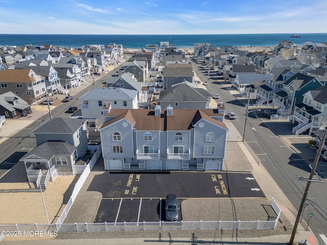 bird's eye view featuring a water view and a residential view