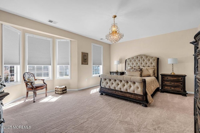 carpeted bedroom featuring an inviting chandelier, baseboards, and visible vents